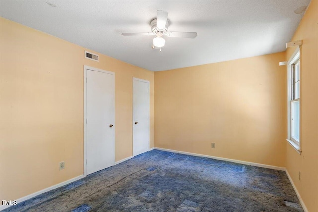 103 Castill Pl, Garner, NC 27529 - unfurnished room with dark carpet, ceiling fan, and plenty of natural light