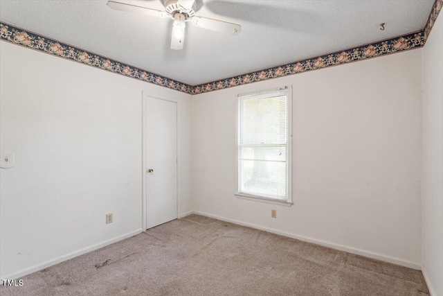 103 Castill Pl, Garner, NC 27529 - spare room featuring carpet, ceiling fan, baseboards, and a textured ceiling