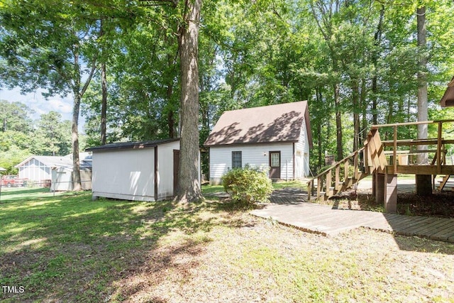 103 Castill Pl, Garner, NC 27529 - rear view of house featuring a wooden deck and stairway