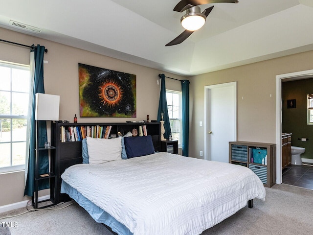3507 Portico Ln, Durham, NC 27703 - carpeted bedroom featuring ensuite bathroom, baseboards, and a ceiling fan