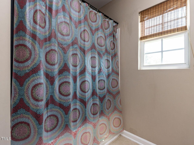 3507 Portico Ln, Durham, NC 27703 - bathroom featuring baseboards and a shower with curtain