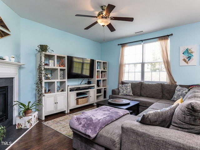 3507 Portico Ln, Durham, NC 27703 - living area featuring dark wood finished floors, a ceiling fan, and a fireplace