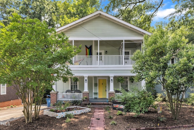 view of front of home featuring a porch and a balcony