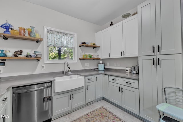 kitchen featuring stainless steel dishwasher, open shelves, a sink, and white cabinetry