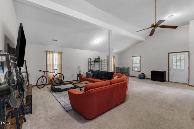 carpeted living area featuring a ceiling fan, healthy amount of natural light, and baseboards