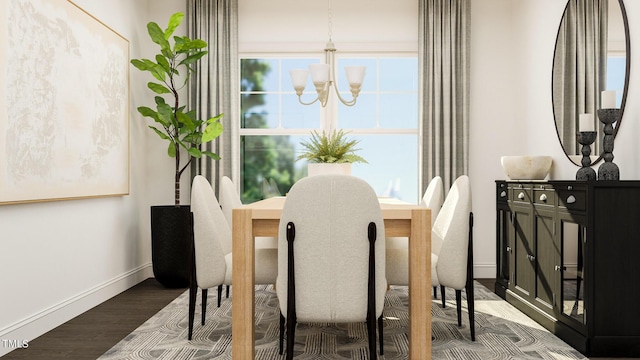 dining room with dark wood-style floors, baseboards, healthy amount of natural light, and a chandelier