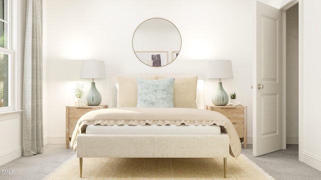 bedroom featuring carpet floors and baseboards
