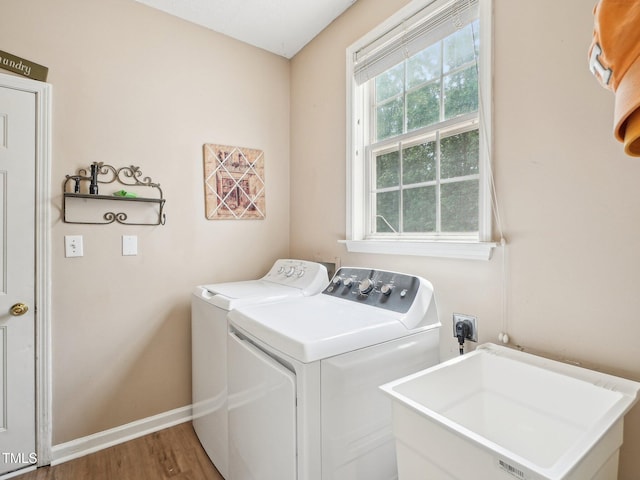 2317 Colony Woods Dr, Apex, NC 27523 - laundry room featuring separate washer and dryer, wood finished floors, and baseboards
