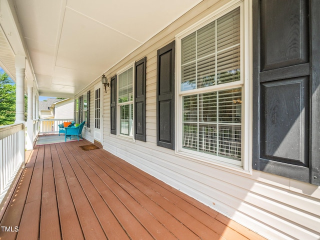 wooden deck featuring covered porch