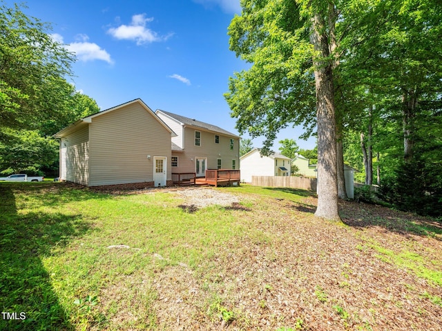 back of property with a wooden deck
