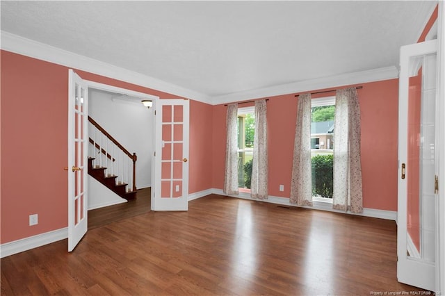 5704 Kindley Dr, Fayetteville, NC 28311 - spare room featuring french doors, wood finished floors, baseboards, stairway, and ornamental molding