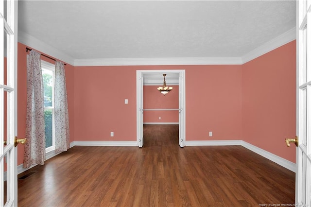 5704 Kindley Dr, Fayetteville, NC 28311 - spare room with a chandelier, wood finished floors, baseboards, and ornamental molding