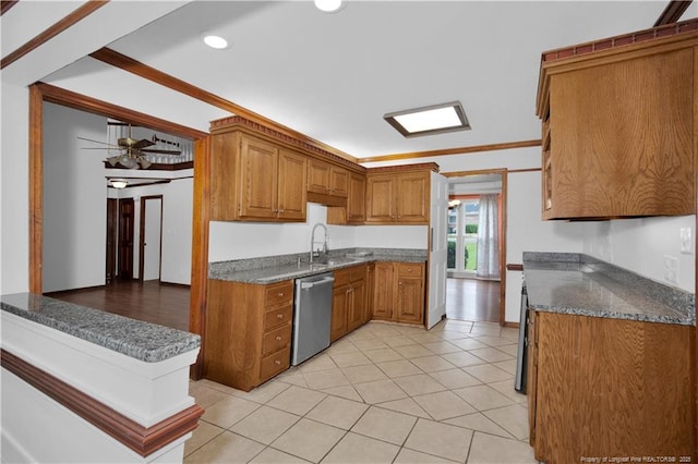 5704 Kindley Dr, Fayetteville, NC 28311 - kitchen featuring stainless steel dishwasher, brown cabinetry, recessed lighting, light tile patterned floors, and ornamental molding