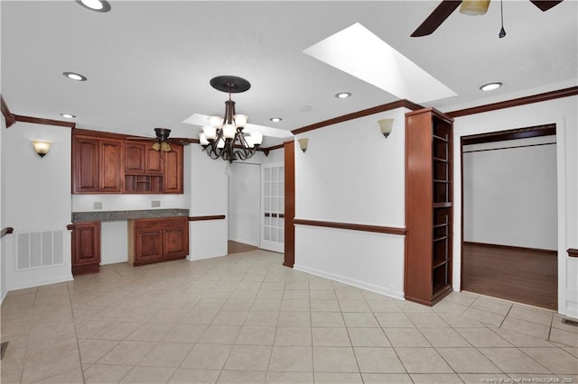 5704 Kindley Dr, Fayetteville, NC 28311 - kitchen featuring crown molding, a ceiling fan, recessed lighting, a chandelier, and pendant lighting