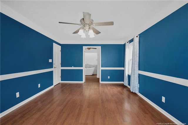 5704 Kindley Dr, Fayetteville, NC 28311 - spare room featuring wood finished floors, a ceiling fan, and baseboards