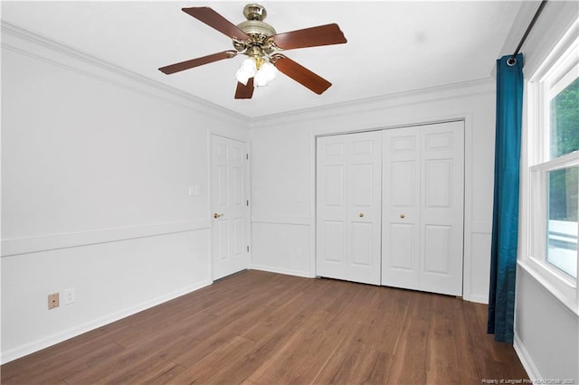 5704 Kindley Dr, Fayetteville, NC 28311 - unfurnished bedroom featuring wood finished floors, multiple windows, crown molding, a closet, and ceiling fan