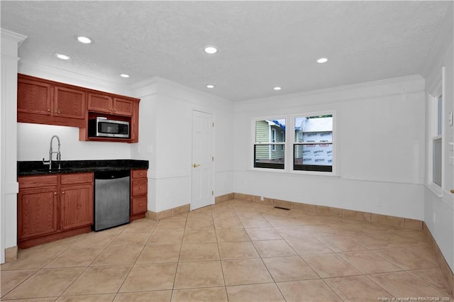 5704 Kindley Dr, Fayetteville, NC 28311 - kitchen with stainless steel appliances, a sink, ornamental molding, recessed lighting, and baseboards