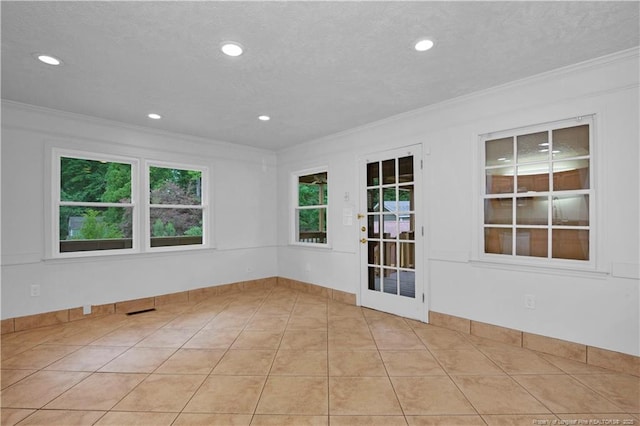 5704 Kindley Dr, Fayetteville, NC 28311 - spare room with ornamental molding, plenty of natural light, recessed lighting, a textured ceiling, and light tile patterned floors