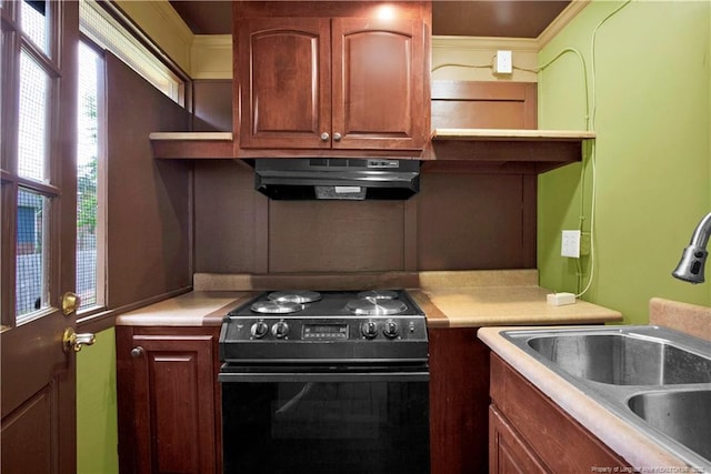 5704 Kindley Dr, Fayetteville, NC 28311 - kitchen featuring black electric range oven, a sink, under cabinet range hood, light countertops, and brown cabinets