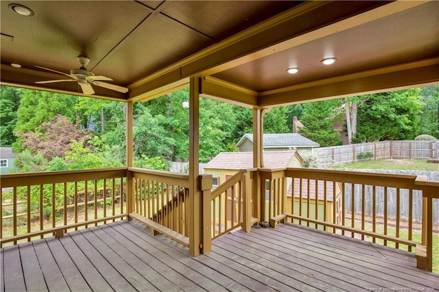 5704 Kindley Dr, Fayetteville, NC 28311 - deck with a ceiling fan, a fenced backyard, and an outdoor structure