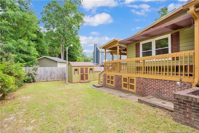 5704 Kindley Dr, Fayetteville, NC 28311 - view of yard featuring a storage unit and an outbuilding