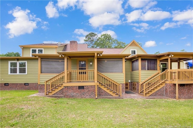 5704 Kindley Dr, Fayetteville, NC 28311 - back of property featuring stairway, a lawn, a sunroom, and crawl space