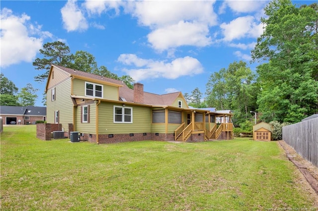 5704 Kindley Dr, Fayetteville, NC 28311 - back of house featuring crawl space, stairs, a chimney, an outdoor structure, and a sunroom