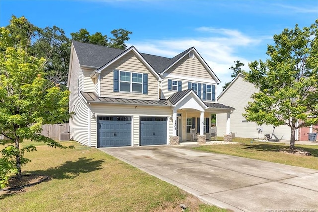 view of front of house with a standing seam roof, a garage, driveway, covered porch, and central AC unit