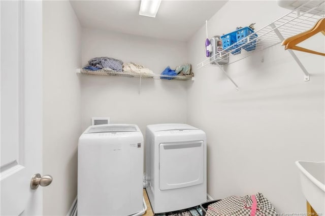 washroom featuring washer and dryer