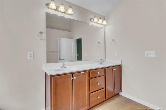 1504 Laguardia Dr, Hope Mills, NC 28348 - bathroom featuring double vanity, tile patterned flooring, and baseboards