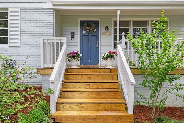 2324 Stevens Rd, Raleigh, NC 27610 - doorway to property with brick siding and a porch