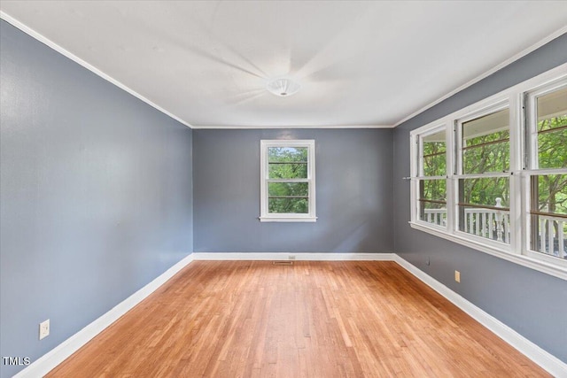 2324 Stevens Rd, Raleigh, NC 27610 - empty room with light wood-type flooring, crown molding, and baseboards