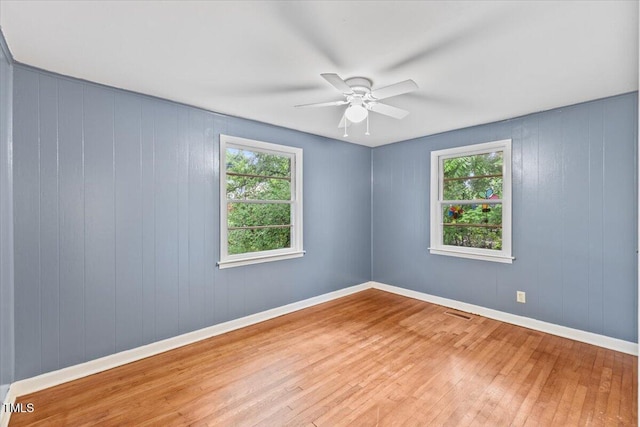2324 Stevens Rd, Raleigh, NC 27610 - spare room with hardwood / wood-style flooring, healthy amount of natural light, ceiling fan, and baseboards