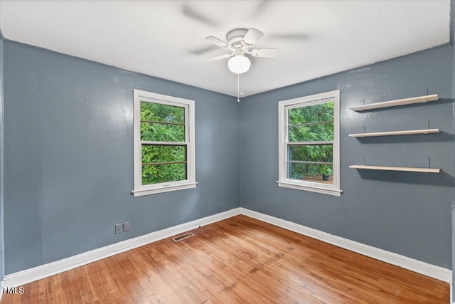 2324 Stevens Rd, Raleigh, NC 27610 - unfurnished room with healthy amount of natural light, baseboards, hardwood / wood-style flooring, and ceiling fan