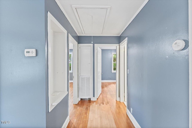 2324 Stevens Rd, Raleigh, NC 27610 - hall with attic access, light wood finished floors, baseboards, and crown molding