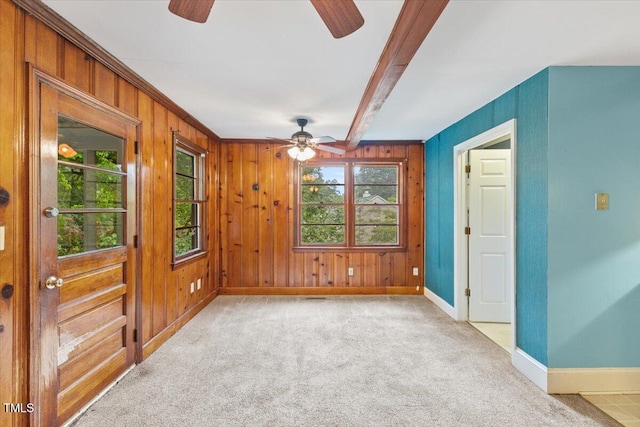 2324 Stevens Rd, Raleigh, NC 27610 - empty room featuring ceiling fan, baseboards, light colored carpet, wooden walls, and beam ceiling