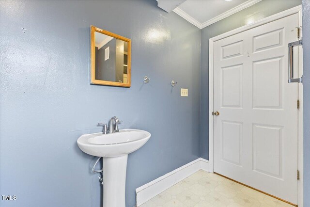 2324 Stevens Rd, Raleigh, NC 27610 - bathroom with crown molding, baseboards, tile patterned floors, and a sink