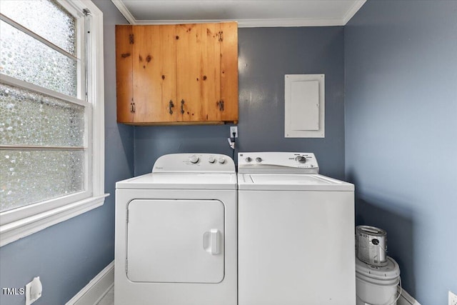 2324 Stevens Rd, Raleigh, NC 27610 - clothes washing area featuring cabinet space, washing machine and clothes dryer, electric panel, baseboards, and ornamental molding