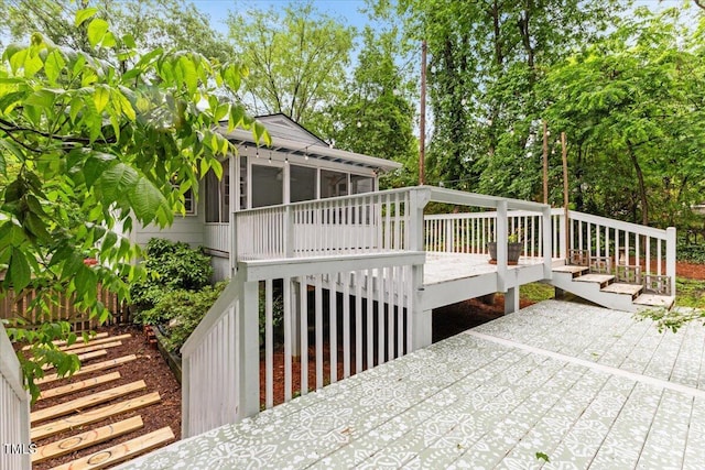 2324 Stevens Rd, Raleigh, NC 27610 - wooden deck featuring a sunroom, stairway, and view of scattered trees
