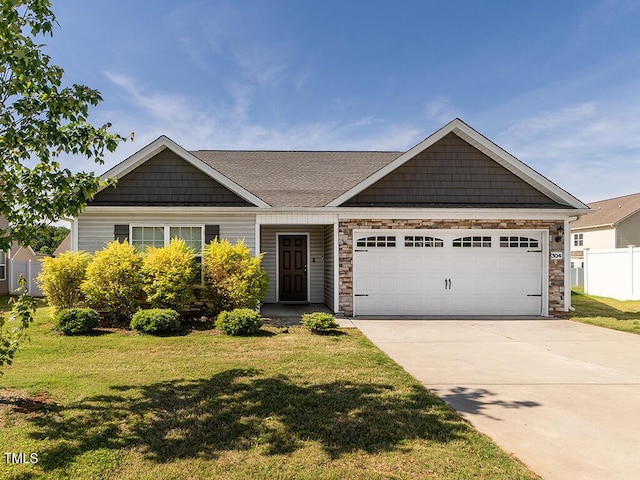 view of front of house featuring an attached garage, concrete driveway, and stone siding