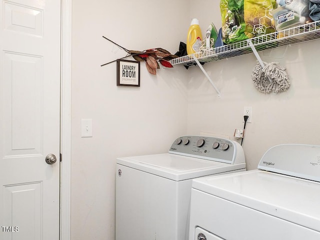 laundry room with washing machine and dryer
