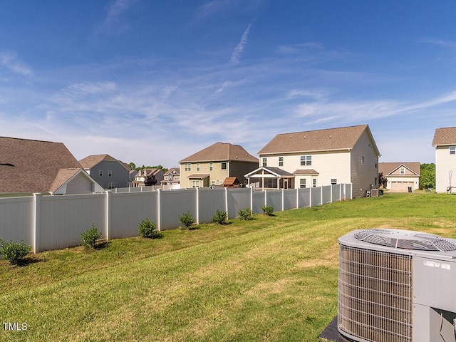 view of yard with cooling unit and a residential view