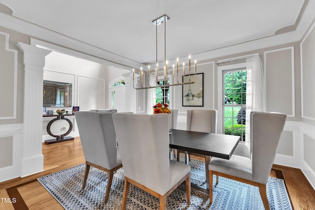 3007 Krogen Ct, Creedmoor, NC 27522 - dining area with a decorative wall, light wood-style floors, and crown molding