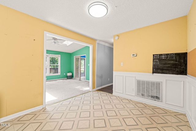 3 Cobble Glen Ct, Durham, NC 27713 - empty room with a textured ceiling, a ceiling fan, and vaulted ceiling