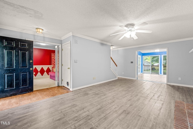 3 Cobble Glen Ct, Durham, NC 27713 - unfurnished living room with wood finished floors, stairs, ceiling fan, a textured ceiling, and ornamental molding