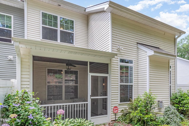 view of exterior entry with ceiling fan
