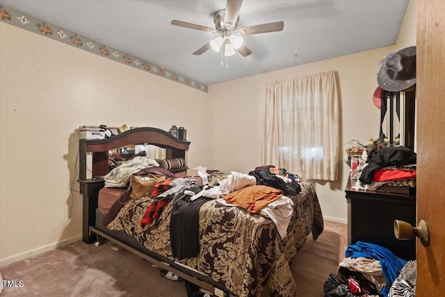 carpeted bedroom with baseboards and ceiling fan