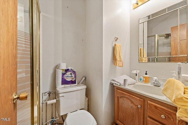 full bath with toilet and vanity