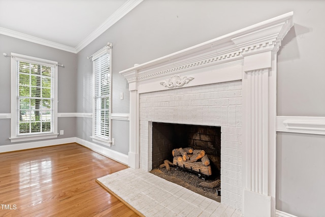 6201 King Croydon Ct, Raleigh, NC 27603 - detailed view of a fireplace, crown molding, and wood finished floors