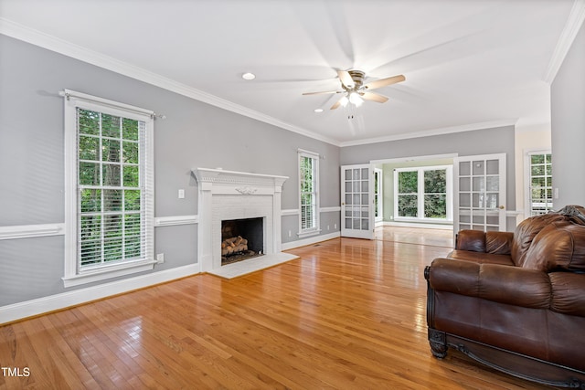 6201 King Croydon Ct, Raleigh, NC 27603 - living room with a ceiling fan, wood finished floors, a brick fireplace, and ornamental molding
